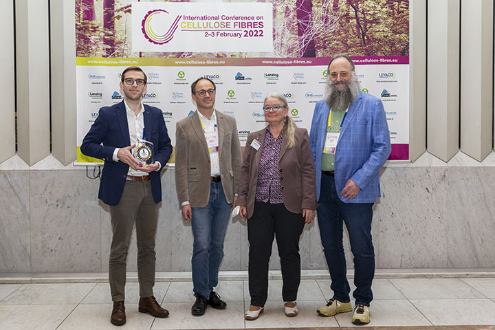 The second-place winner receives the Cellulose Fibre Innovation of the Year Award 2022. Left to right: Wolfgang Aichorn, GIG Karasek (award sponsor); Hermann Dauser, Fibers365 (second place, innovation award); Asta Partanen and Michael Carus, both Nova-Institut). First place DITF and third place Kelheim Fibres participated online. Photo courtesy of PvP/Nova-Institut