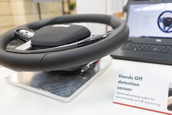 IEE are using a flexible sensor mat integrated into the driver’s steering wheel to detect human contact with the wheel within half a second. Photo courtesy of Messe München